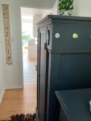a kitchen with a black refrigerator in a room at Rent My Studio in Powell River