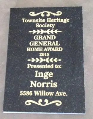 a black plaque with white writing on it at Rent My Studio in Powell River
