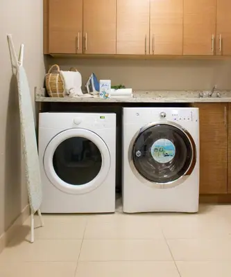a washing machine and a washer in a kitchen at Welcome Home in North Vancouver