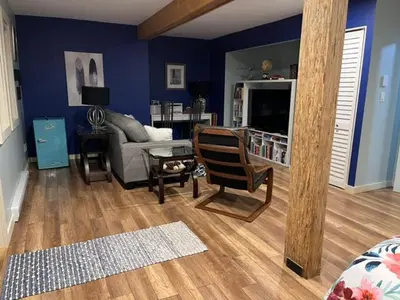 a living room with a couch and a table at Cottonwood#2 in Youbou