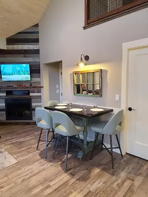 a dining room with a table and chairs at The Nest in Lantzville