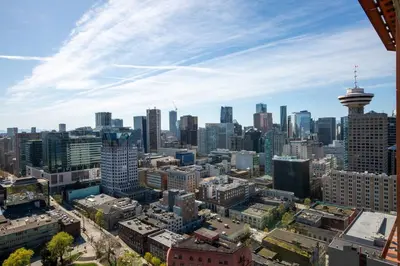 an aerial view of a city skyline with a tower at Central Luxury Apartment with Best City Views! in Vancouver