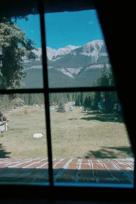 a view of a mountain from a window at Rustic Beaverfoot Lodge in Parson