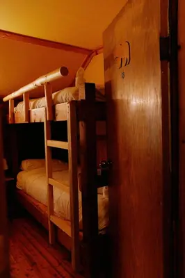 an open door to a room with bunk beds at Rustic Beaverfoot Lodge in Parson