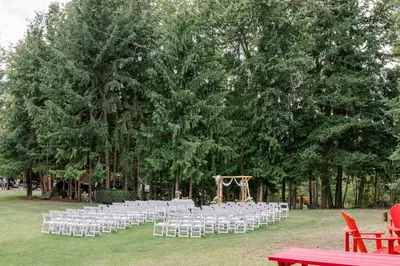 a bunch of chairs are set up for a wedding at Anglemont Inn in Anglemont