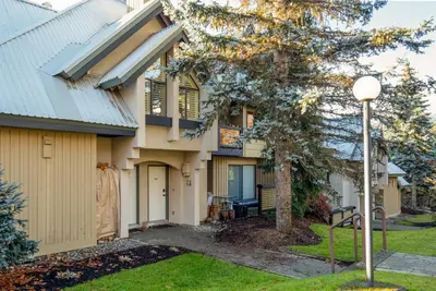 a house with a street light in front of it at 3BR in Wintergreen, Family Sized, Wood Burning Fireplace, Secure Parking, Ski Hill Bus Access in Whistler