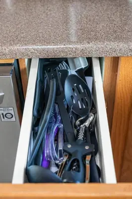 a drawer full of kitchen utensils in a counter at Comfy Getaway - Walk to West Ed Mall in Edmonton