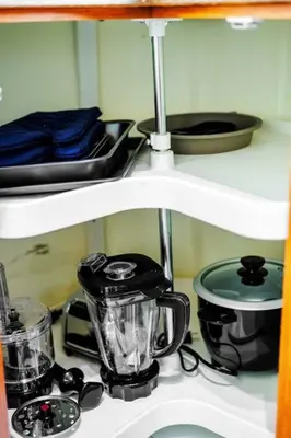 a kitchen counter with appliances on a shelf at Comfy Getaway - Walk to West Ed Mall in Edmonton