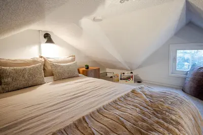 a bedroom with a large bed with a roof at 1BR plus Loft in Gondola Village, Creekside, Amazing Patio with Views, Near Gondola, Free Parking in Whistler