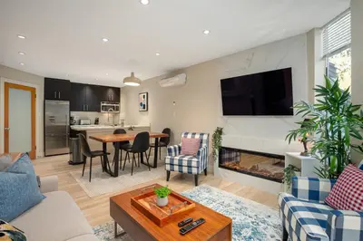 a living room with a couch and a fireplace at 1BR plus Two Dens in The Gables, Epic Location Near Gondolas, Private Balcony, Fireplace, Parking in Whistler