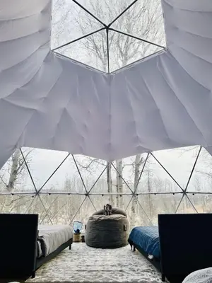 a room with two beds in a plastic tent at Refuge Bay's Aer XL Dome Luxury Off Grid Escape in Cherhill