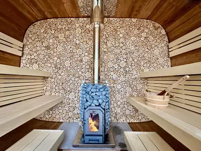 a blue stove in a room with a wall at Refuge Bay's Aer XL Dome Luxury Off Grid Escape in Cherhill