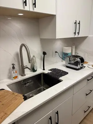 a kitchen counter with a sink and a toaster at Cozy Townhouse in Whistler Village North in Whistler