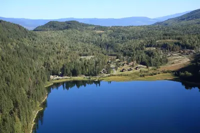 an aerial view of a lake in the mountains at Alpine Meadows Resort in Clearwater