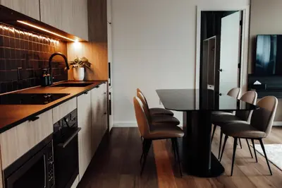 a kitchen with a table and chairs in a room at Smithe House in Vancouver