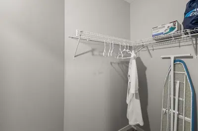 a towel rack in a room with two tennis rackets at Meriweather - Calgary Breathtaking 1-bedroom apartment in Calgary