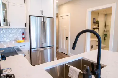 a kitchen with a stainless steel refrigerator at New 1 Bed Condo with Mtn Views in Harrison Hot Springs