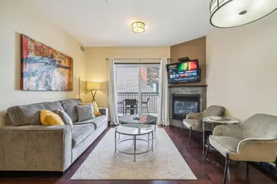 a living room with a couch and a fireplace at Cozy One Bedroom Condo with Indoor Pool and HotTub in Canmore