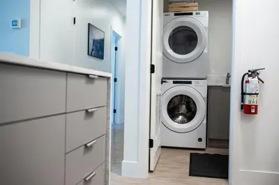 a laundry room with a washer and dryer at Birdies and Bears by Revelstoke Vacations in Revelstoke
