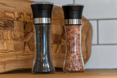 two salt and pepper shakers sitting on a table at Elegant Boho Retreat - 8 min to WEM in Edmonton