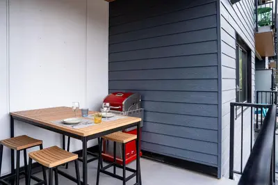 a small table and chairs next to a wall at Summit Views Condo by Revelstoke Vacations in Revelstoke
