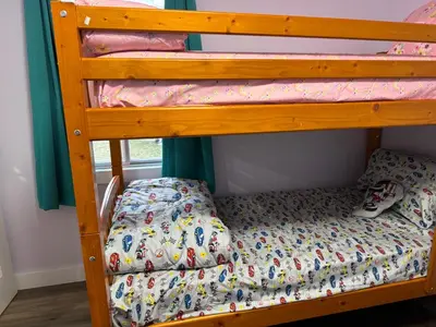 a bunk bed in a bedroom with a bunk bed in a room at Farmstay in Edmonton in Duffield