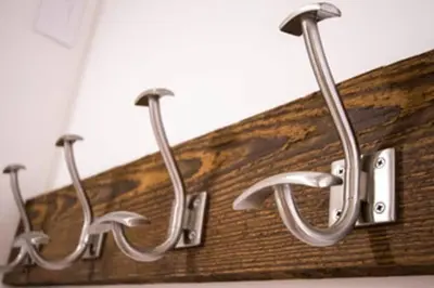 three horseshoes hanging on a wall in a bathroom at Bear Lodge, Whistler Village - Spectacular Location on Village Stroll, Designer Remodel in Whistler
