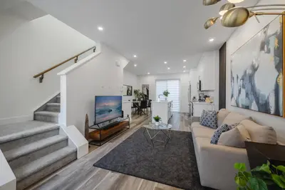 a living room with a couch and a fireplace at Townhome with Free Parking, Near Downtown in Calgary