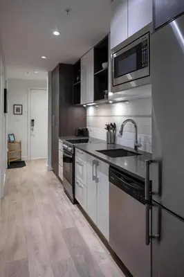 a kitchen with a sink and a microwave at Be The Perfect Cityzen In Cityzen in Victoria