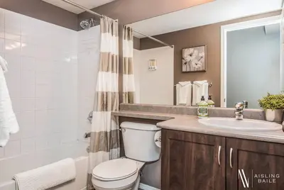 a bathroom with a toilet and a sink at Contemporary, Cozy, Pool, Hot Tub, Lake Front in Invermere