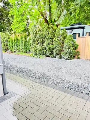 a garden with a gravel road and a fence at Fort Langley Homestead in Maple Ridge District Municipality