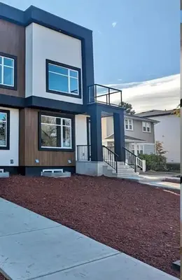 a large house with a driveway in front of it at M21 Luxurious, Downtown River Valley Home, Centrally located, Close to everything in Edmonton