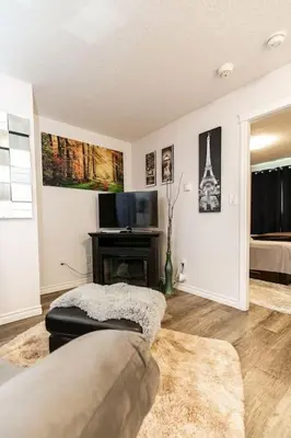 a living room with a couch and a television at Super wow view! in Victoria