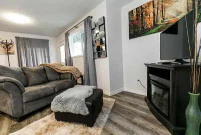 a living room with a couch and a television at Super wow view! in Victoria