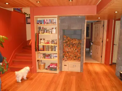 a dog standing in a room with a book shelf at beard's creek bed and breakfast in Parson