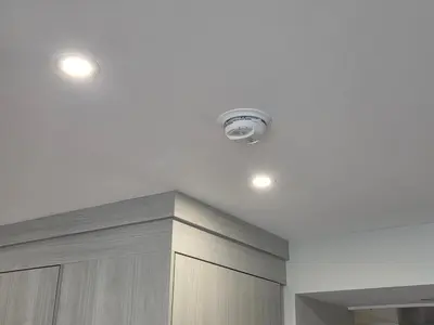 a kitchen with two lights on a white ceiling at PeachView Deluxe Suites 301 in Peachland