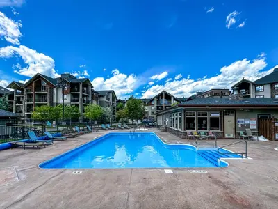 a swimming pool in a apartment complex with condos at Lake Windermere Pointe by StayIn in Invermere