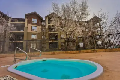 a large blue tub in front of a building at Lake Windermere Pointe by StayIn in Invermere
