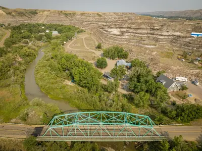 an aerial view of a bridge over a river at D5 Nordic Nook - 1 King Suite in Drumheller