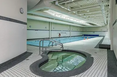 an empty swimming pool with a swimming pooliteratoriteratorhaarhaarhaarhaarhaarhaar at Stylish 2BD Condo in Downtown with Marina View in Vancouver