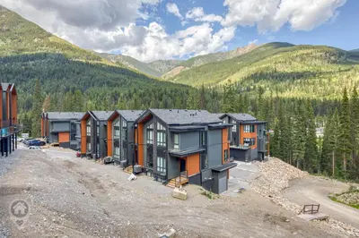 an aerial view of a row of houses in the mountains at Nordix Townhomes by StayIn in Panorama