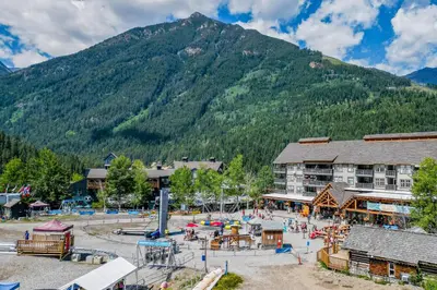 an amusement park in front of a mountain at Nordix Townhomes by StayIn in Panorama
