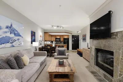 a living room with a couch and a fireplace at Spacious 3BR Condo in Whistler in Whistler