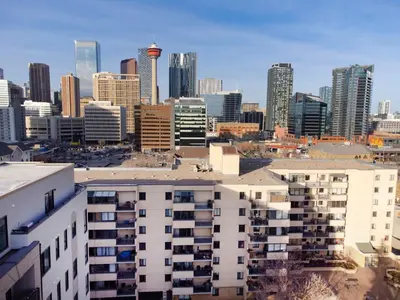 a view of a city skyline with tall buildings at Stylish DT Views at Stampede w Free Parking and AC in Calgary