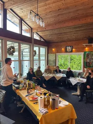 a group of people sitting at tables in a restaurant at Fishermans Folly in Lund
