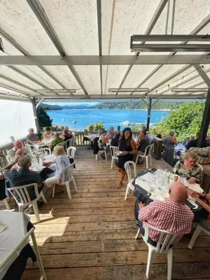 a group of people sitting at tables in a restaurant at Fishermans Folly in Lund