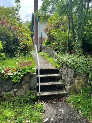 a set of stairs leading up to a house at Green House in Vancouver West in Vancouver