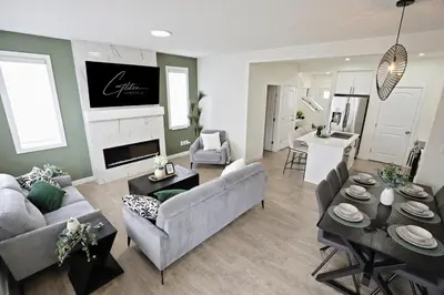a living room with a couch and a table at Elegant Retreat with King Beds,Golf,Disney,Near WEM in Edmonton