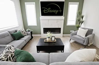 a living room with a couch and a fireplace at Elegant Retreat with King Beds,Golf,Disney,Near WEM in Edmonton