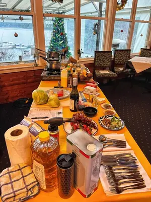 a table with food and a christmas tree in a room at Shannaghs Sweet Escape in Powell River